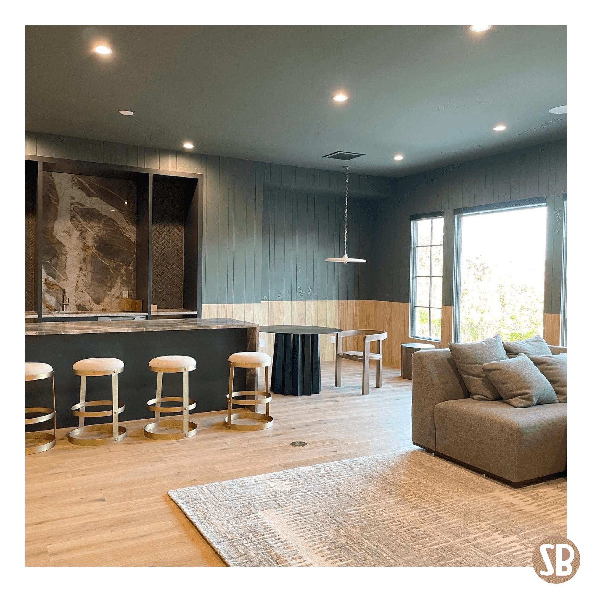 A modern room design featuring a dining room table and a Skee-Ball Home Alley machine