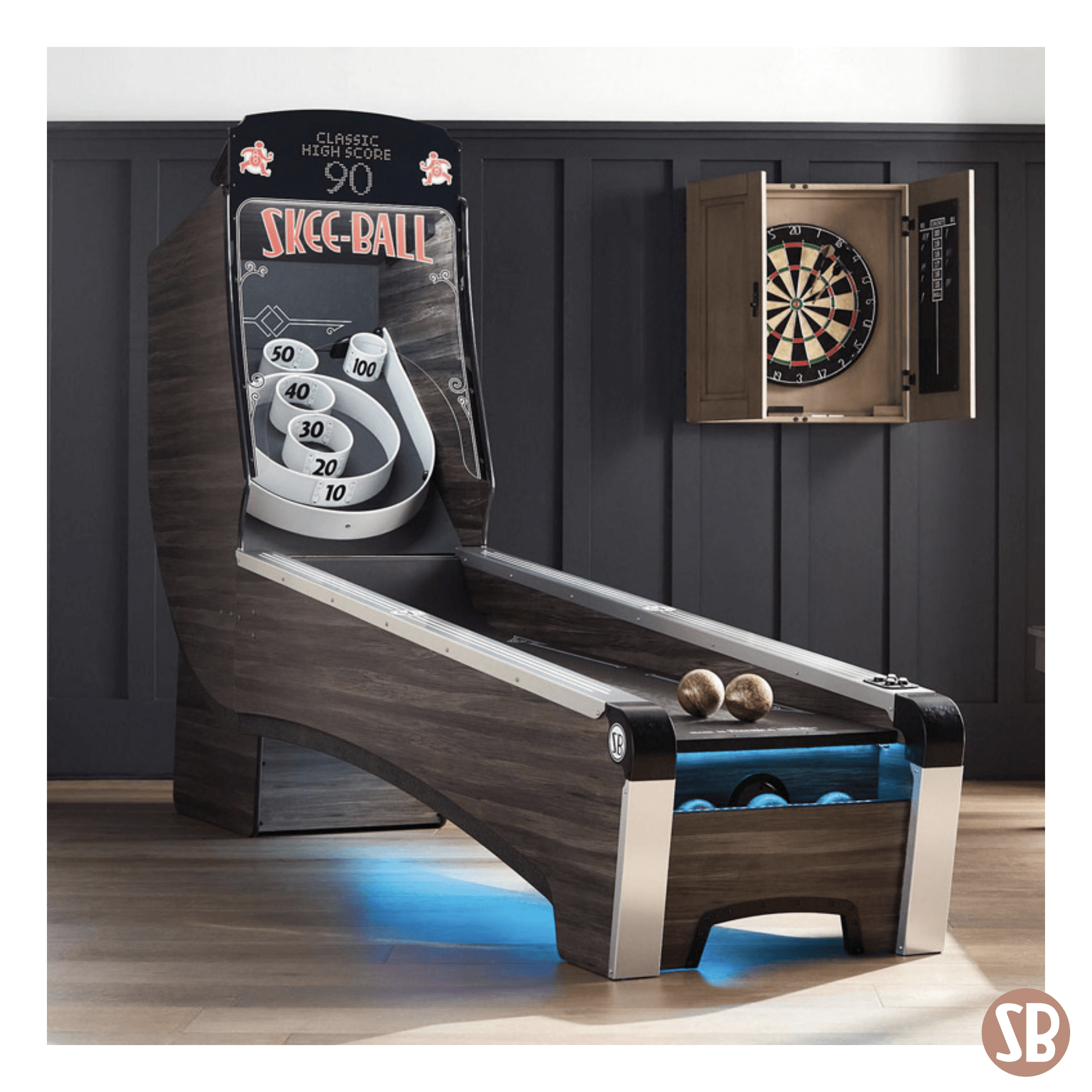 A Skee-Ball Home Alley machine next to a dart board