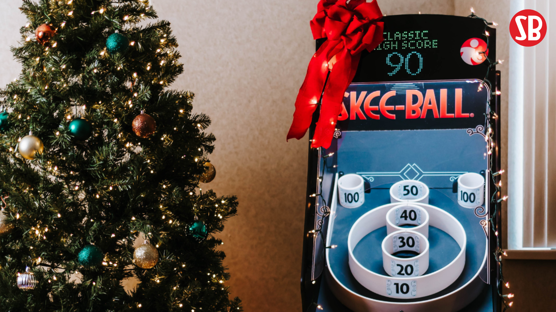 Skee-Ball Home Arcade Game next to Christmas tree